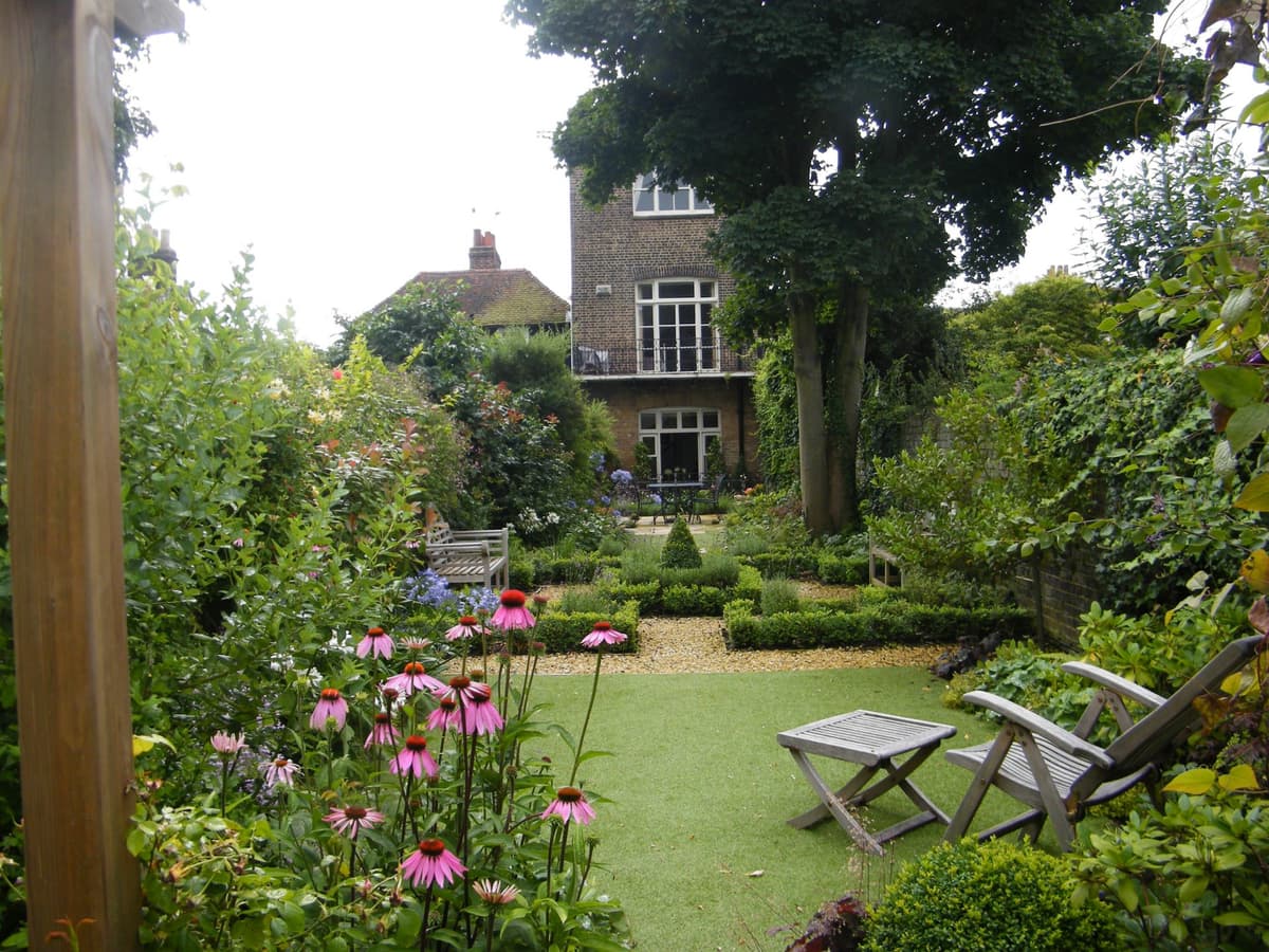 Traditional English garden with shrub borders and structured planting