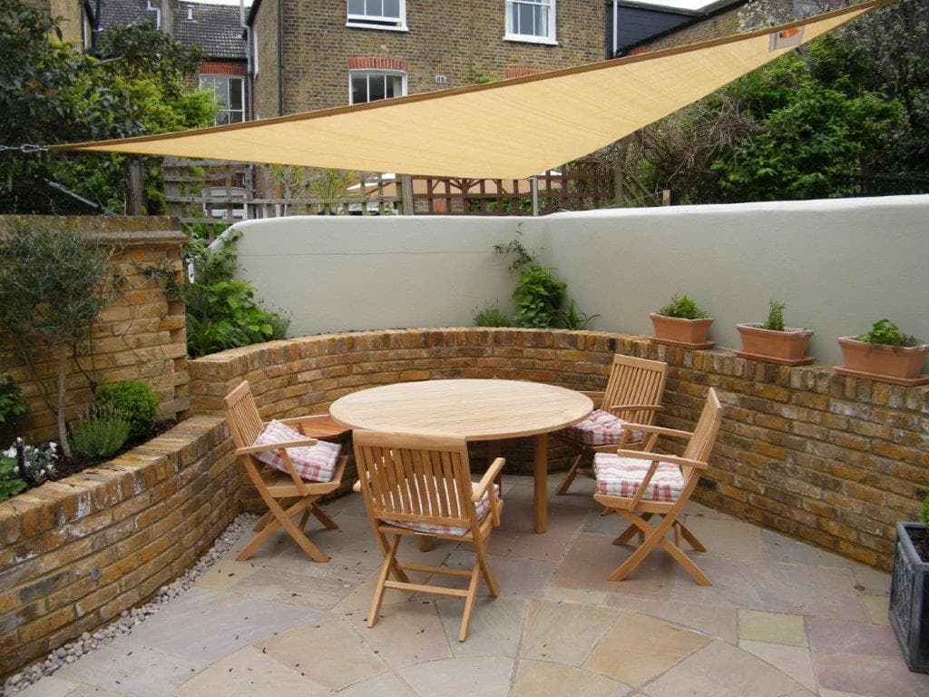 Completed garden design in South West London showing evergreen structure and layered planting